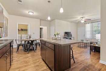 Expansive Kitchen Island with Overhead Lighting